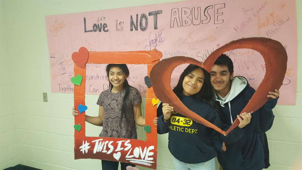 Students posing with props