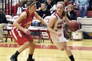 Karen Riley dribbles down the court