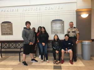 Chief Deputy Dybevick posing with students at the Prairie Justice Center