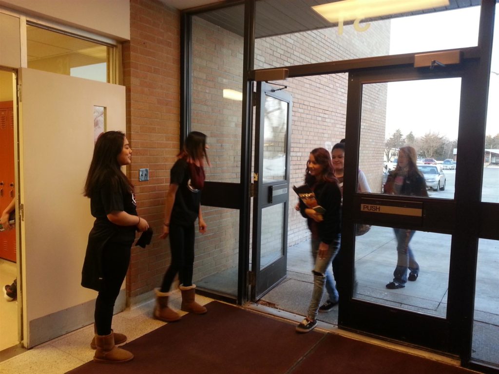 SADD members greeting students