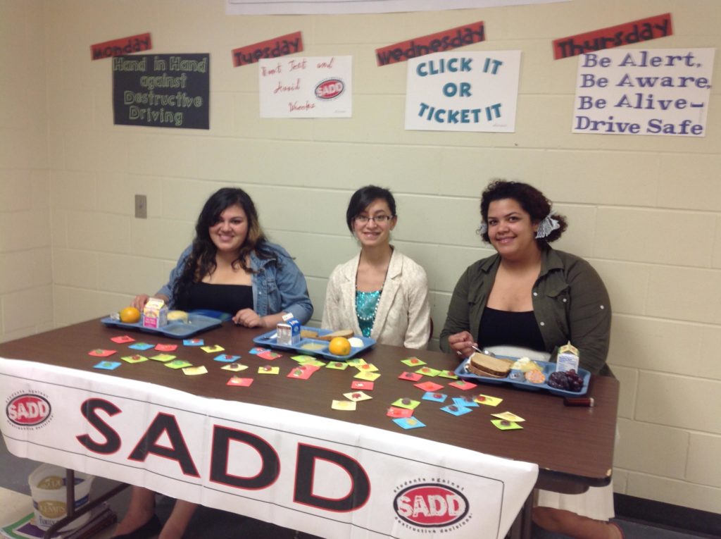 SADD members sitting at a table