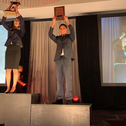 Victor Villalobos holding up his second place award.