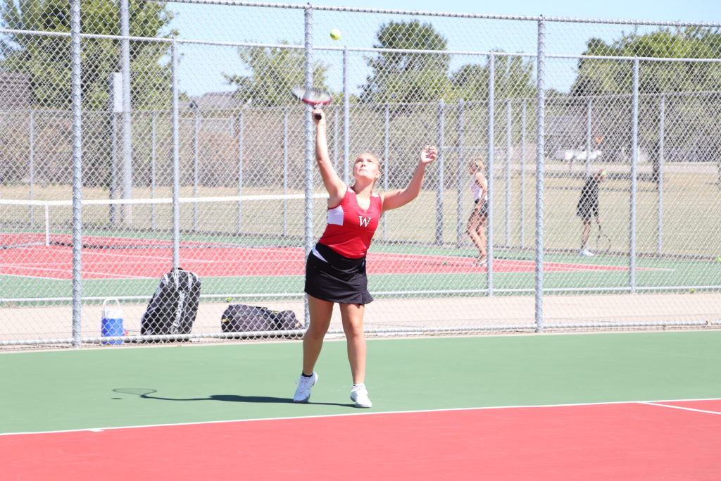 Trojan tennis player serving