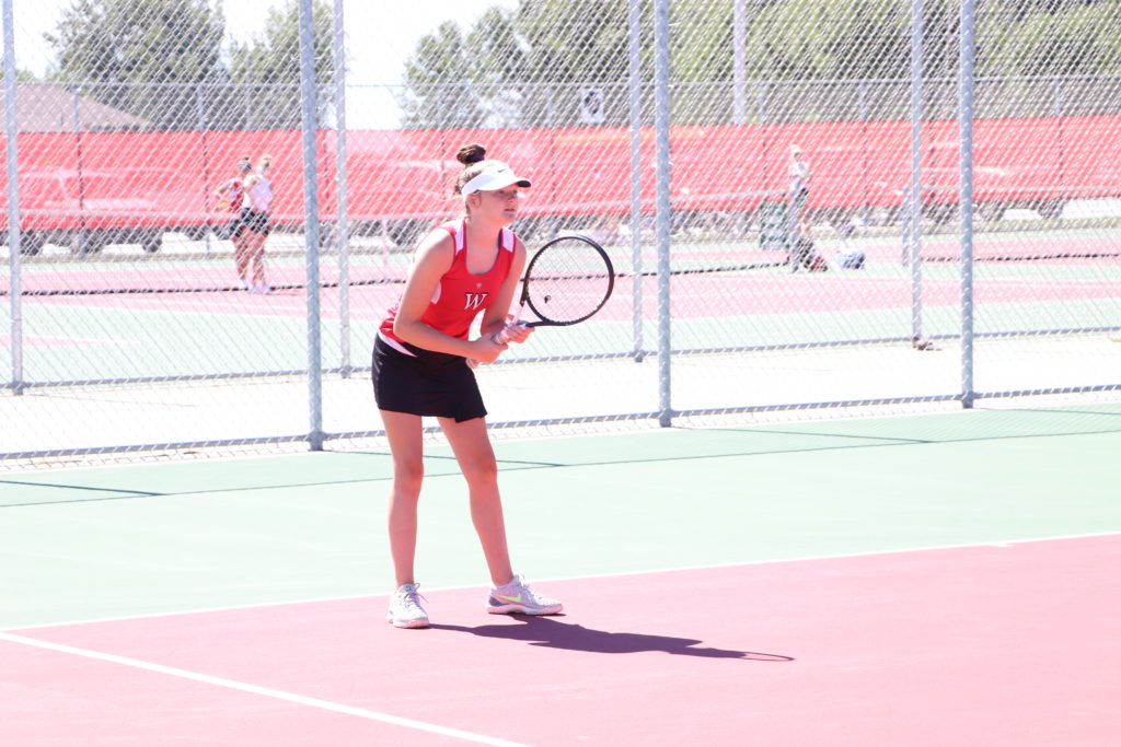 Trojan tennis player waiting for the serve