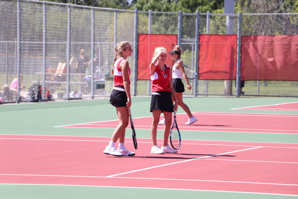 Two Trojan tennis players 