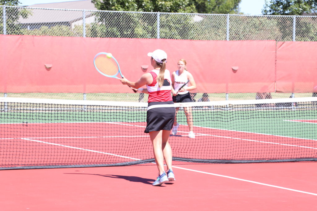 Trojan tennis player waiting for the ball