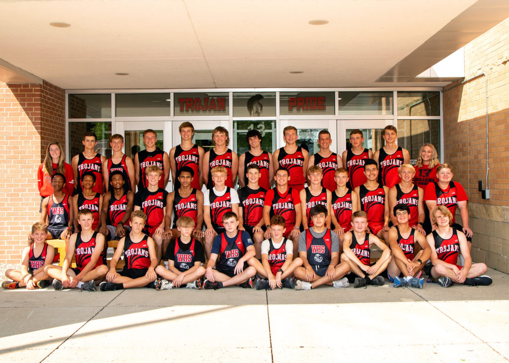 33 runners in front of the high school in three rows