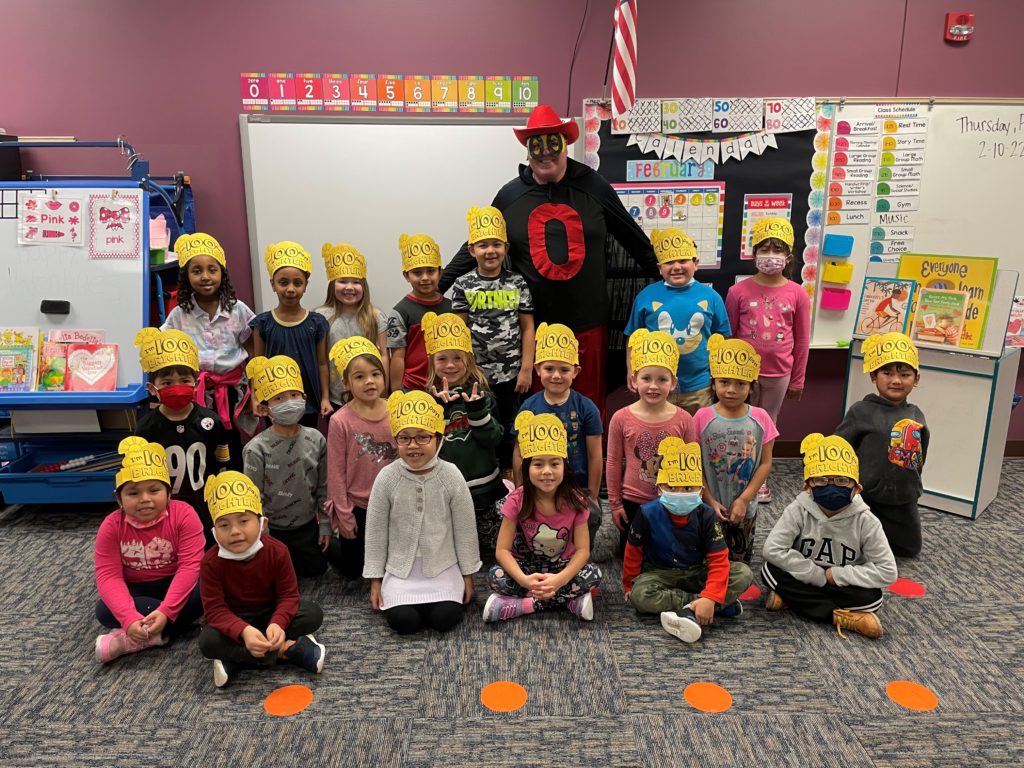 Student with Zero the Hero on the 100th day of school