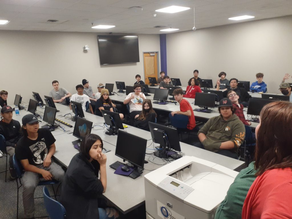 Students in computer lab listening to directions