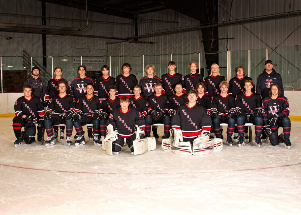 22 student hockey players with 2 coaches