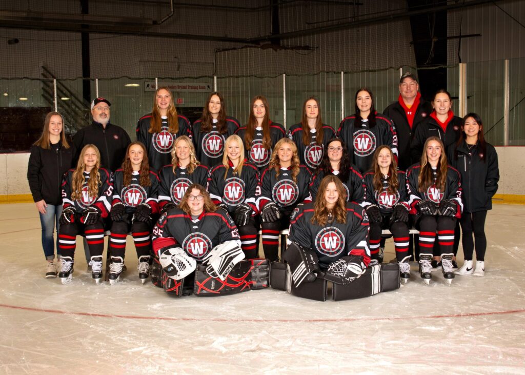 15 girls hockey players, 4 coaches and 1 student manager