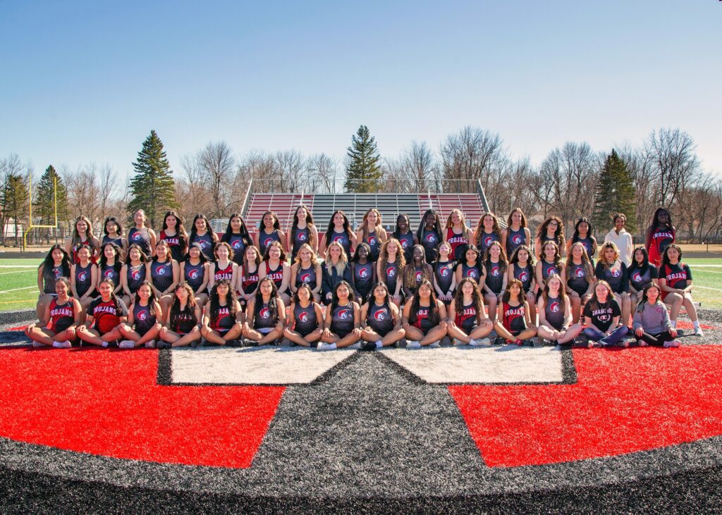 Girls Track Team lined up on the field in 3 rows