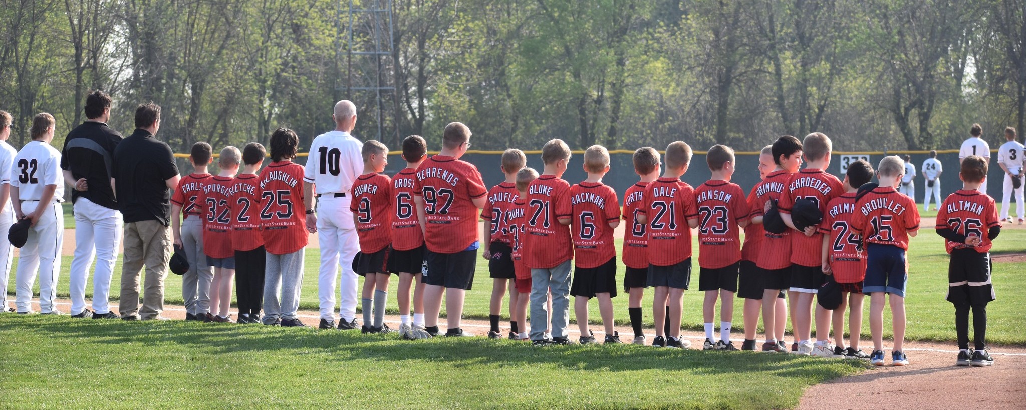 baseball team lined up with young players