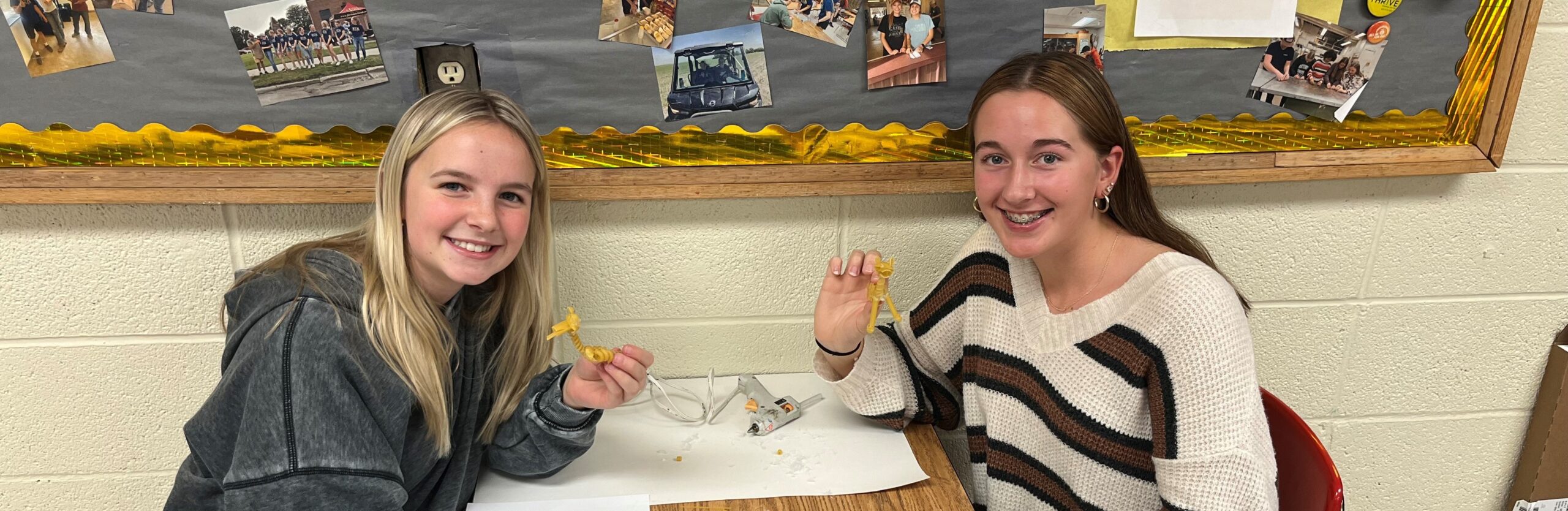 2 students with 3D printed animals