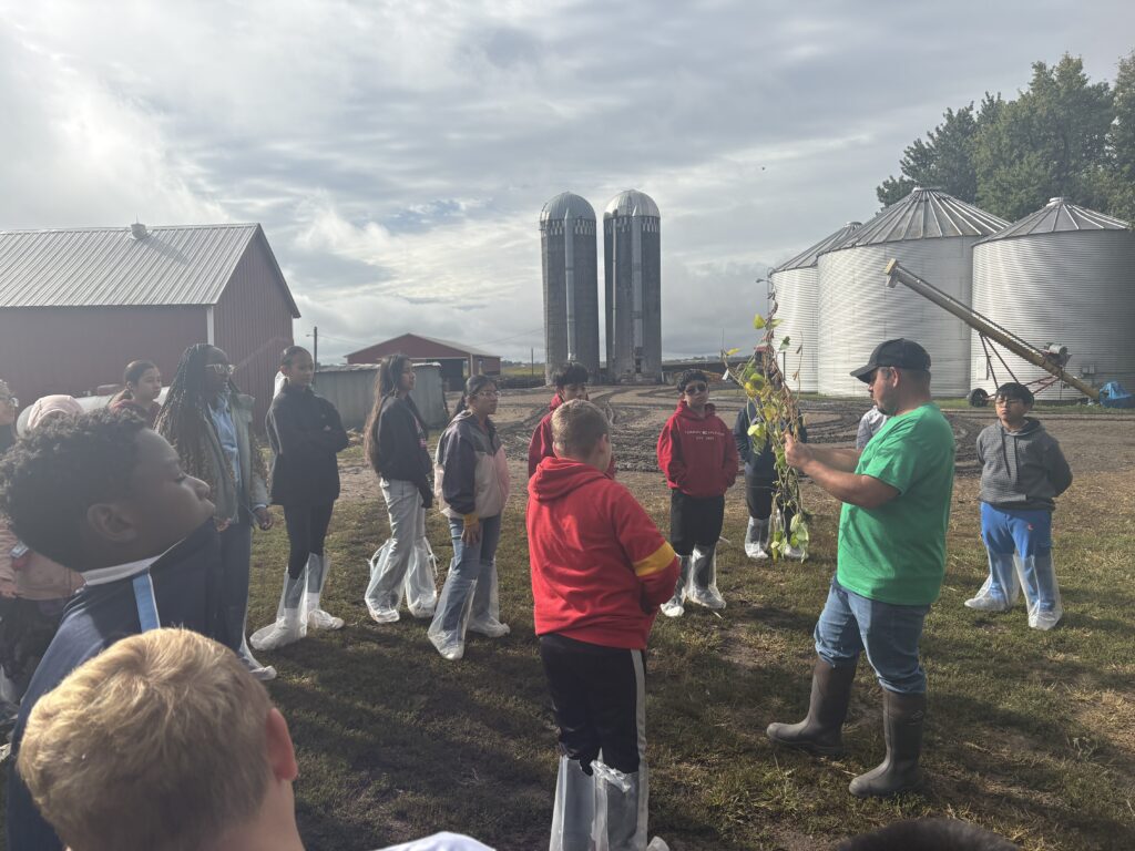 middle school students on a farm