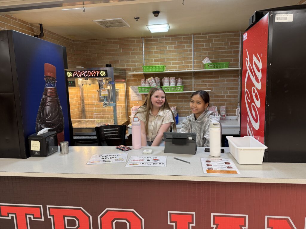2 students working in the concession stand
